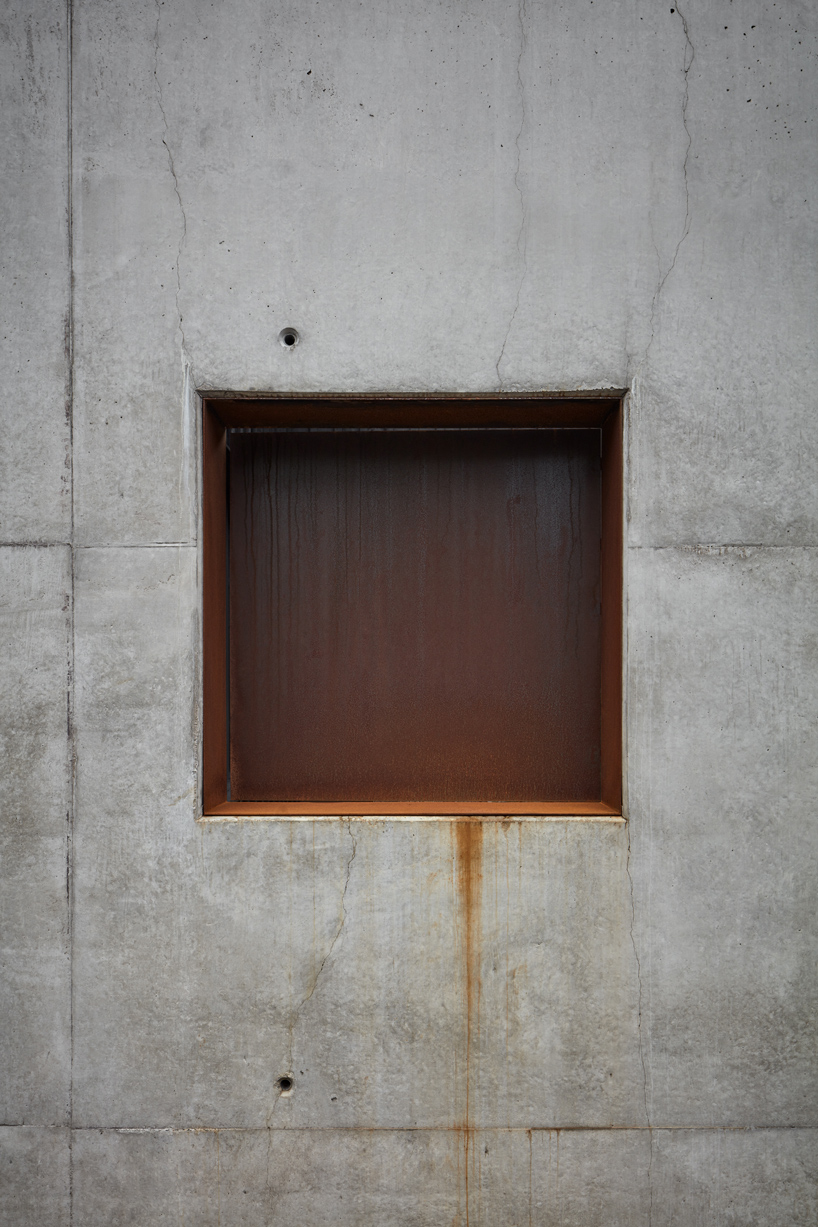 mjolk house behind wall