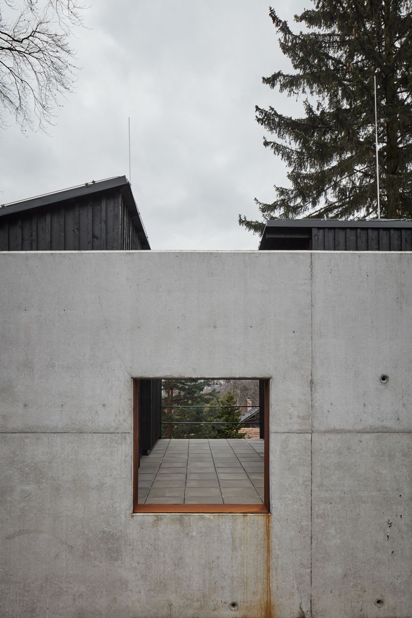 mjolk house behind wall