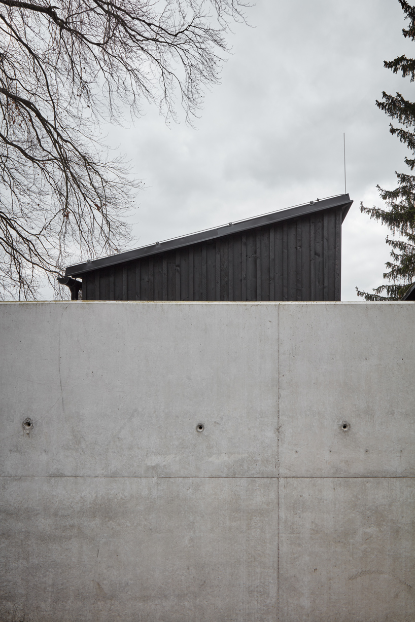 mjolk house behind wall