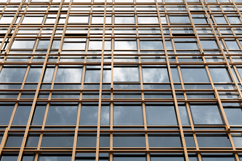 nendo's timber-grid tokyo building tops out with a sky forest terrace