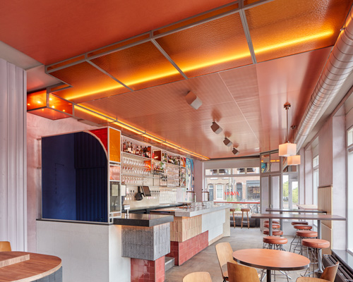 studio modijefsky combines smoked oak, lilac + neon orange for bar ramona in amsterdam