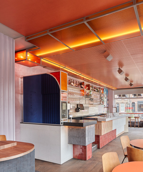 studio modijefsky combines smoked oak, lilac + neon orange for bar ramona in amsterdam