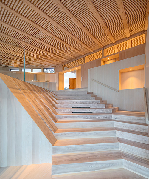 norwegian island house expressed with folded surfaces and rhythmic timber structure