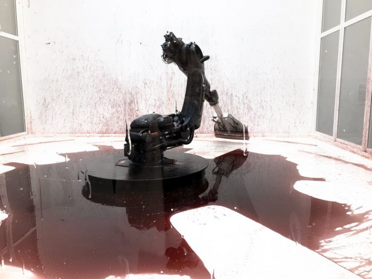 industrial robot continuously sweeps blood-like fluid in sun yuan