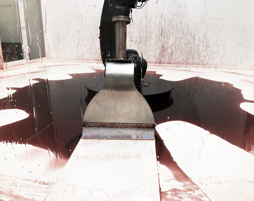 industrial robot continuously sweeps blood-like fluid in sun yuan