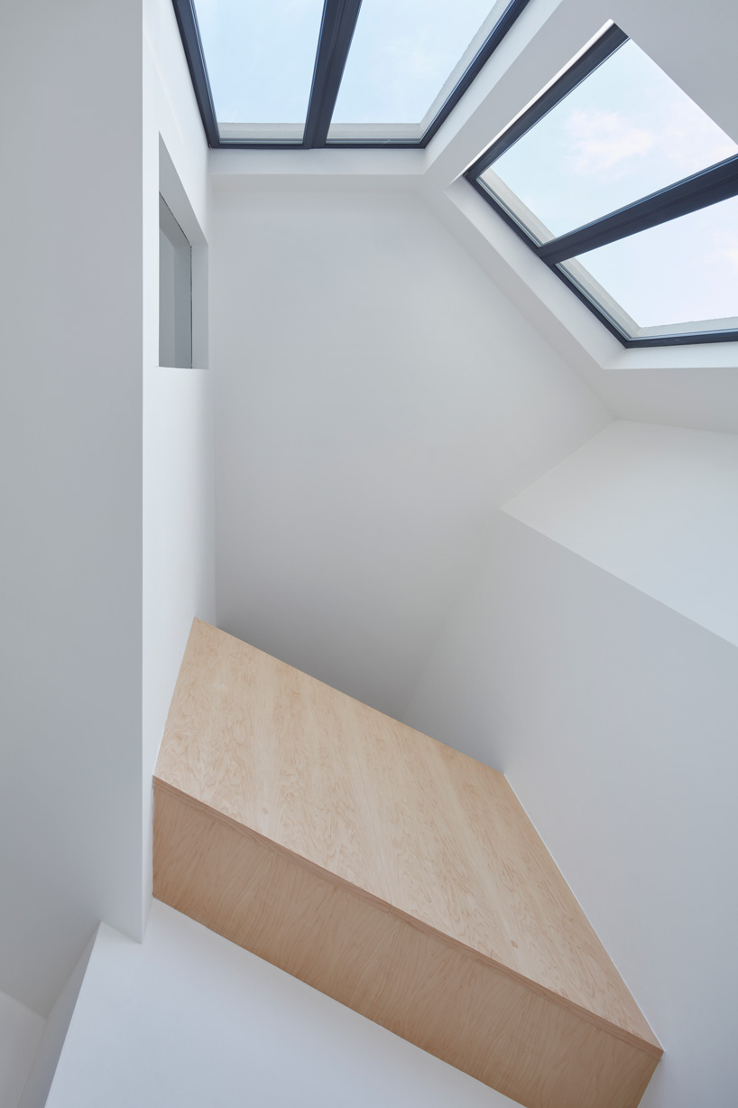 CHYBIK + KRISTOF completes five-story loft building with concrete + ash wood