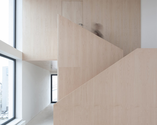 CHYBIK + KRISTOF completes five-story loft building with concrete + ash wood