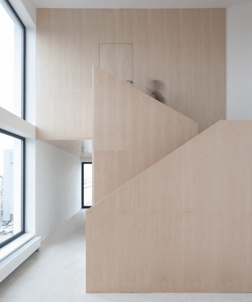CHYBIK + KRISTOF completes five-story loft building with concrete + ash wood