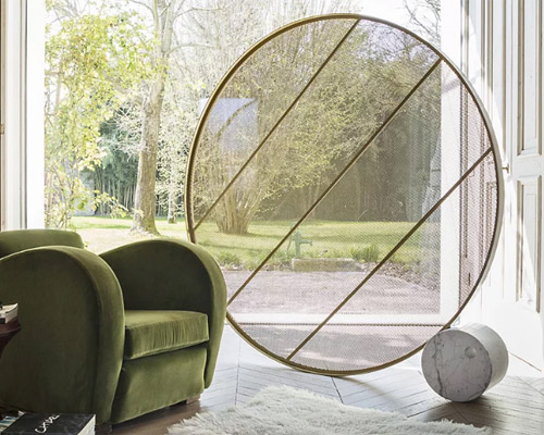 alessandro di prisco uses brass and marble to design the 'swing' circular room divider