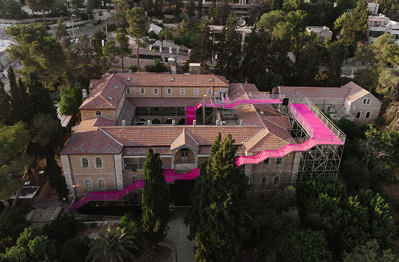 a pink staircase reorients this historic hospital in jerusalem to face the east