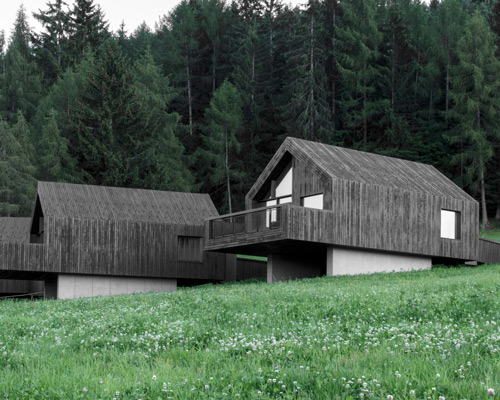 bergmeisterwolf elevates three 'forest houses' at the foot of an italian woodland