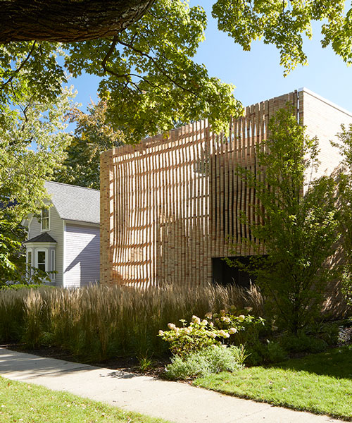 the façade of this house in chicago boasts an array of twisting brick columns