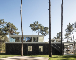 bica arquitectos finishes portuguese house with coat resembling the bark of pine trees