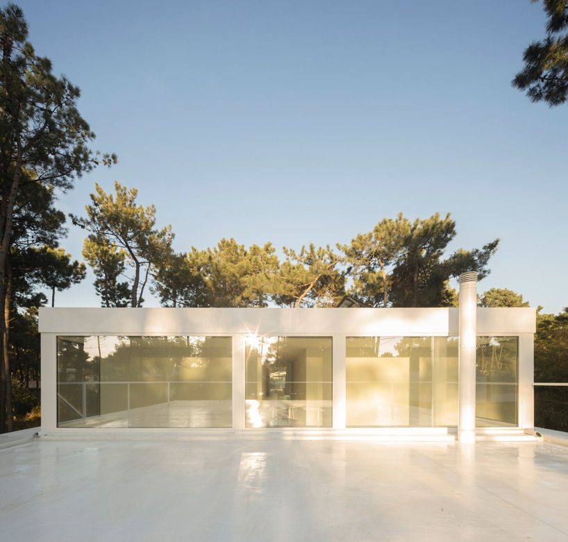 bica arquitectos finishes portuguese house with coat resembling the bark of pine trees