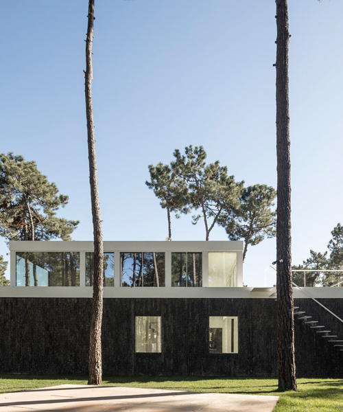 bica arquitectos finishes portuguese house with coat resembling the bark of pine trees