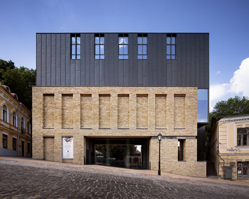 drozdov&partners uses titanium zinc and recycled bricks to clad theater in kiev