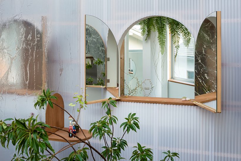 located in a quiet residential area at the foot of mount rokkō, kobe city, japan, the hat house by fumiaso architect & associates is built as a series of irregularly-shaped spaces, enclosed by a compact triangular shell.