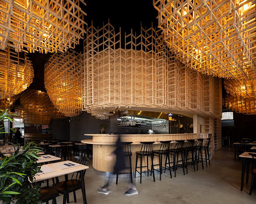 JCFS architects suspends wooden trellises inside lisbon's 'ajitama' ramen bistro