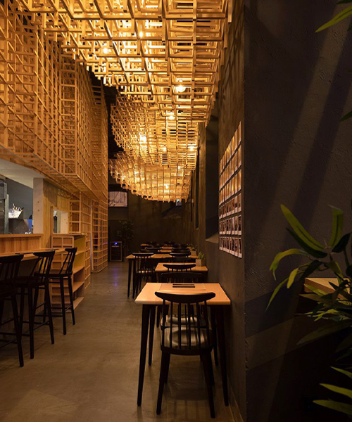 JCFS architects suspends wooden trellises inside lisbon's 'ajitama' ramen bistro