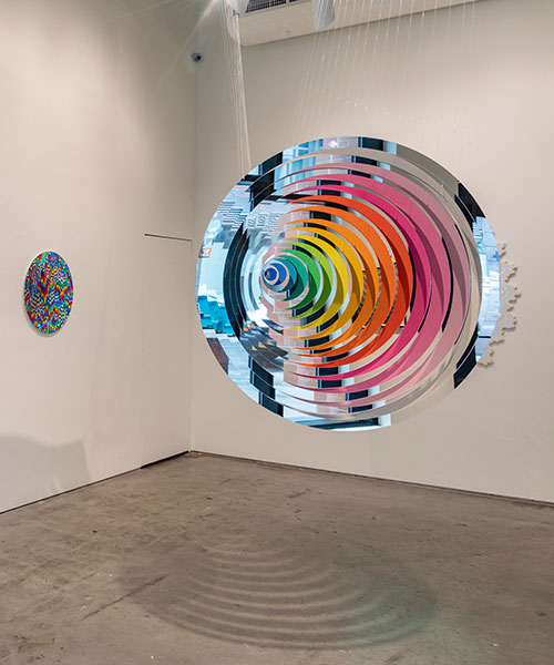 jen stark transforms new york city gallery into illusionistic kaleidoscope of color