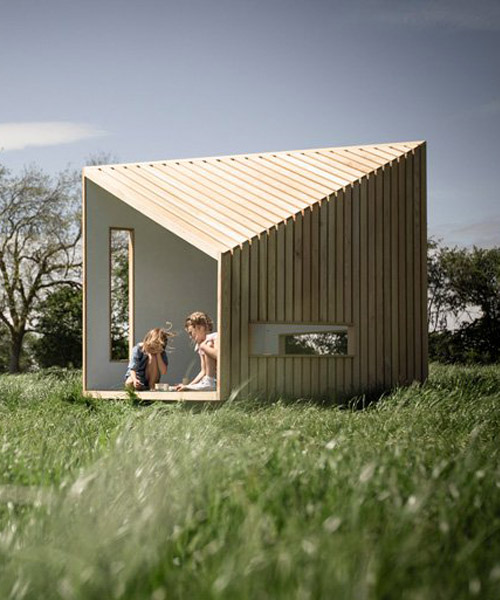 koto prefabricates the 'ilo playhouse' using larch timber and recycled rubber