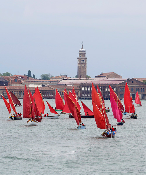 melissa mcgill choreographs 50 traditional sailboats with red sails in the venetian lagoon