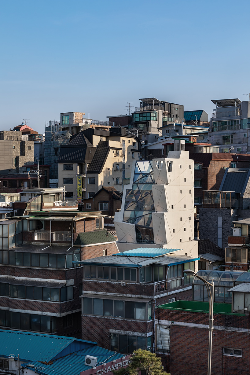 moon hoon manipulates a stack of ‘buckets’ for queens bucket HQ in seoul