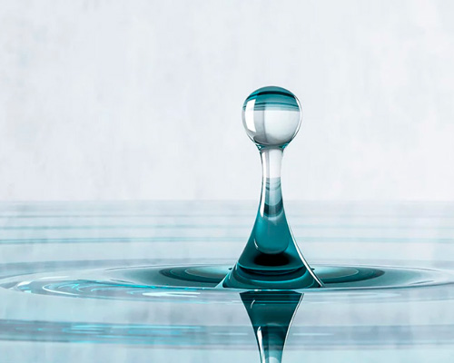 mousarris materializes a drop creating ripples in glass table