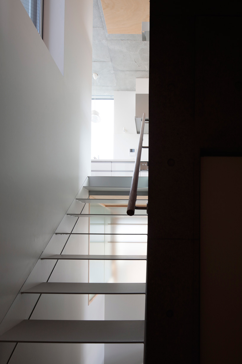 ondesign partners builds compact urban cabin with concrete and wood in tokyo