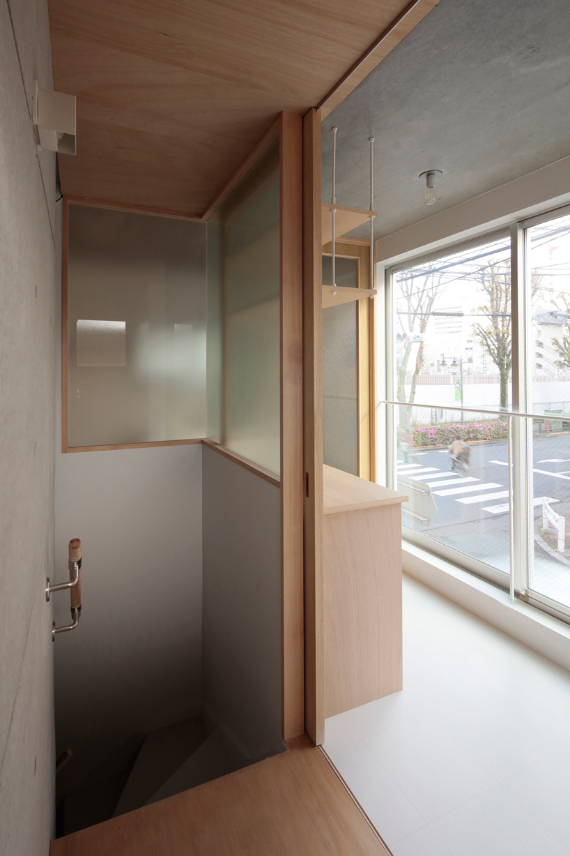 ondesign partners builds compact urban cabin with concrete and wood in tokyo