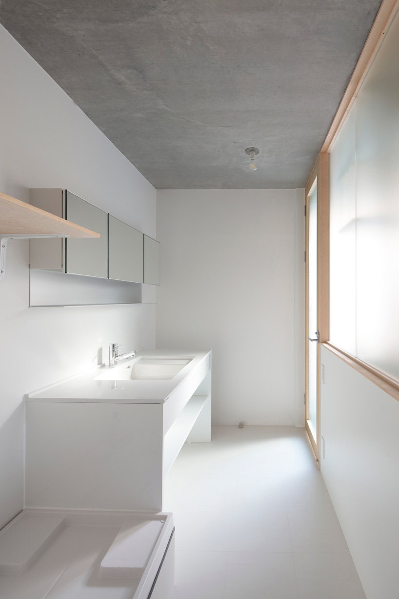 ondesign partners builds compact urban cabin with concrete and wood in tokyo