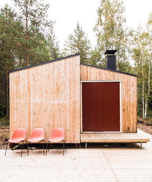 politaire erects wooden cabin in finnish forest with locally-sourced materials