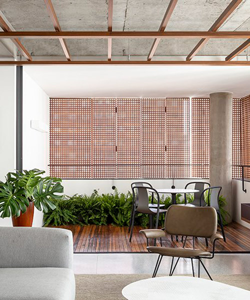 a wooden grid ceiling illuminates SC apartment by pascali semerdjian arquitetos in sao paulo