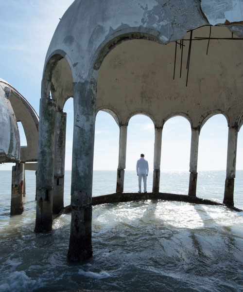 simon faithfull roams the water-bound ruins of a futuristic beach house in florida