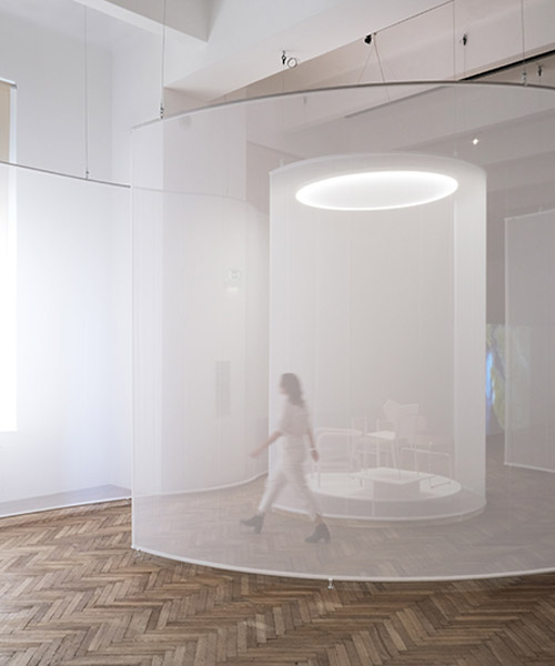 some place studios' ethereal screens lead viewers through exhibition in vienna
