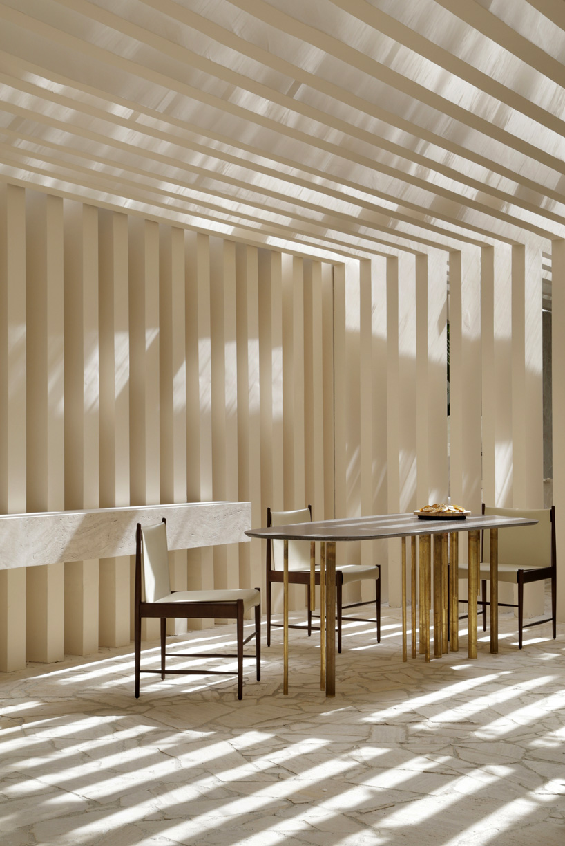 studio otto felix incorporates two existing trees in sibipirunas house at CASACOR são paulo