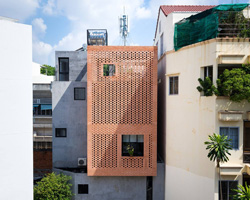 tropical space combines perforated clay brick + concrete for NDC house in vietnam