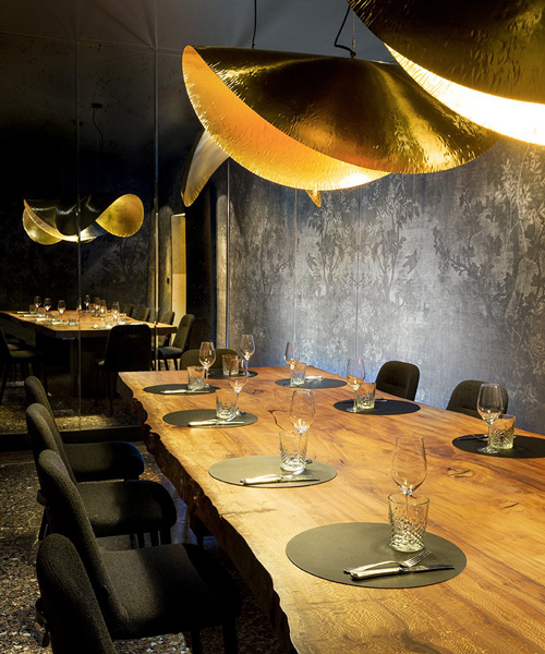 visual display carefully restores the 150 year old 'vitello d'oro' restaurant in udine, italy