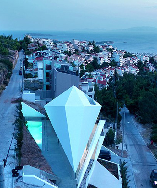 314 architecture studio folds a house like origami on the greek hillside