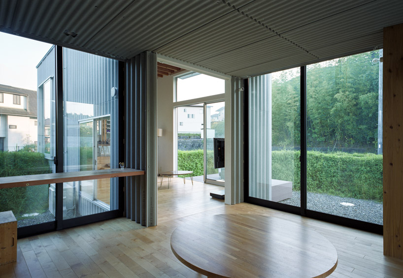 fujiwaramuro architects encircles house inside a greenery ring in japan