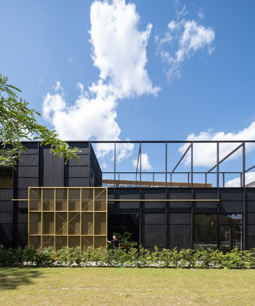 all-black 'house M&M' in amsterdam is accessed via a giant sliding door