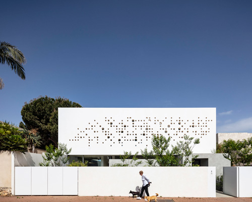 anderman architects completes house in israel with perforated concrete façade