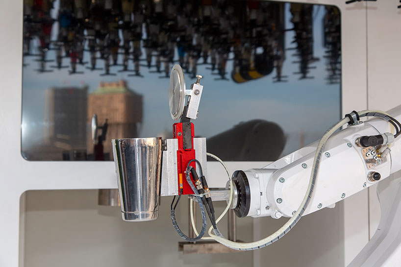 carlo ratti’s robotic bartender mixes drinks on a milanese rooftop