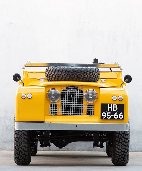 coolnvintage and deus ex-machina present a restored, motorcycle-hauling land rover
