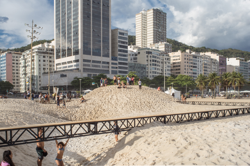 pedro varella's copacabana beach installation results in a new topographic landscape
