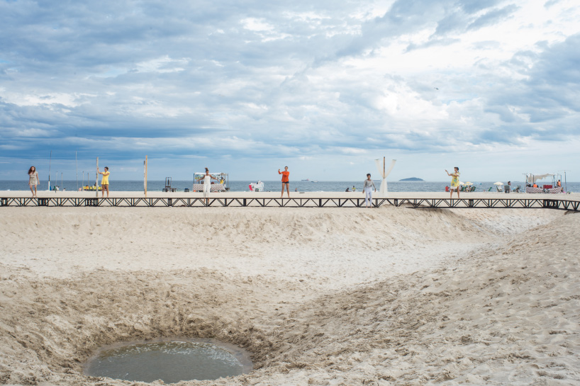 pedro varella's copacabana beach installation results in a new topographic landscape
