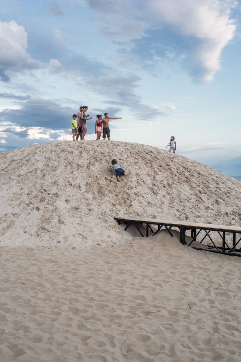 pedro varella's copacabana beach installation results in a new topographic landscape