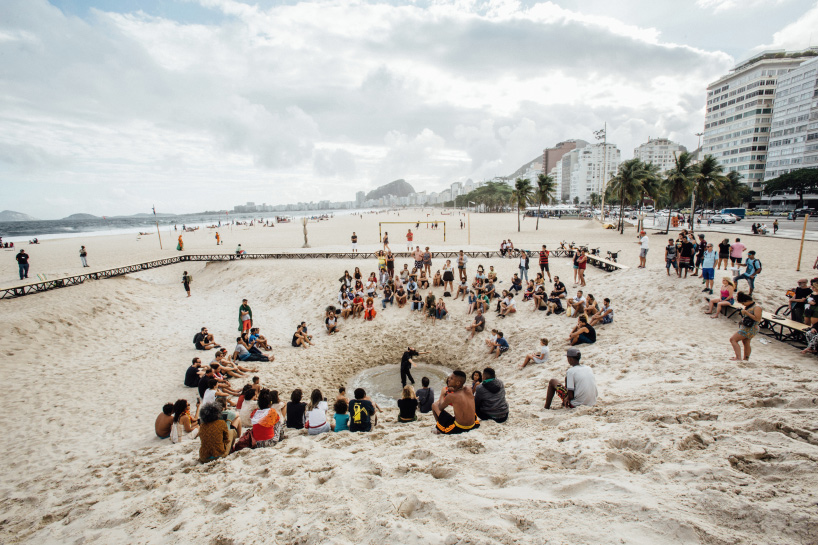 pedro varella's copacabana beach installation results in a new topographic landscape