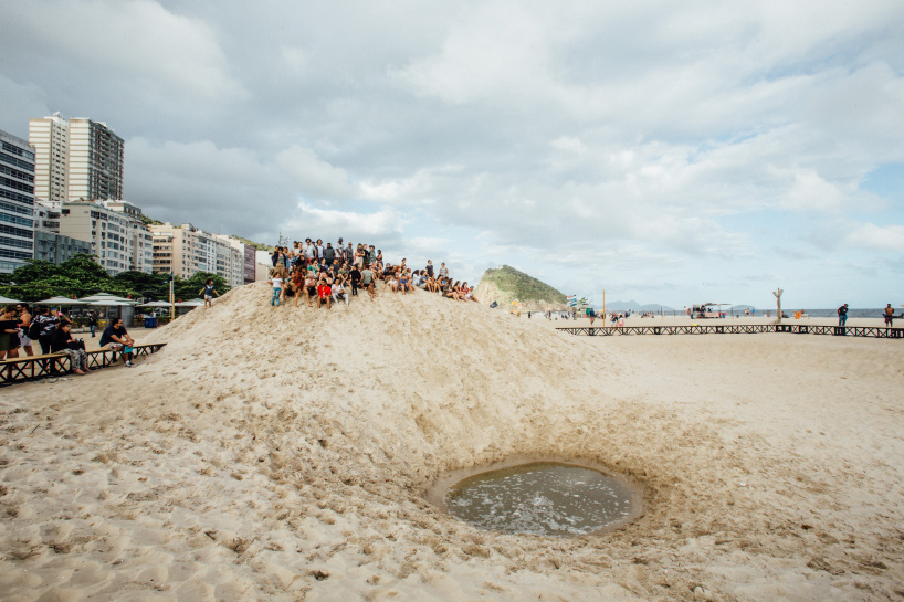 pedro varella's copacabana beach installation results in a new topographic landscape