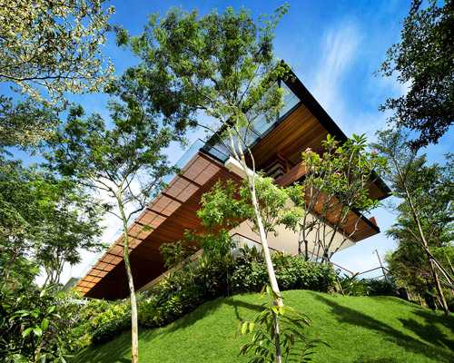 guz architects cantilevers the botanica house over the lush nature of singapore